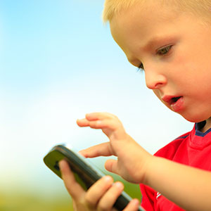 Boy looking at a smart phone